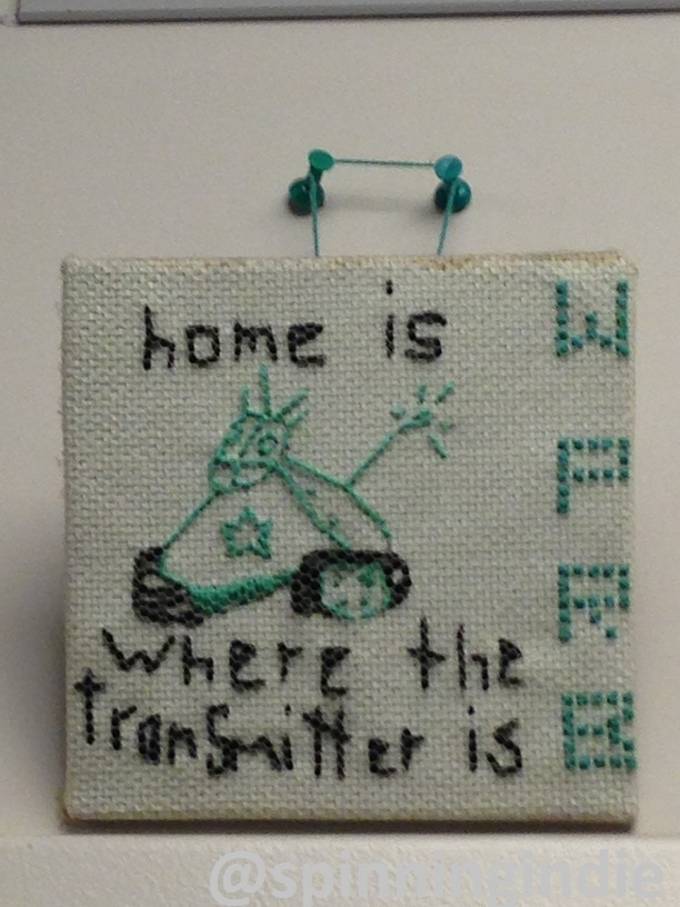 WPRB cross-stitch on the wall of the WPRB studio. Photo: J. Waits