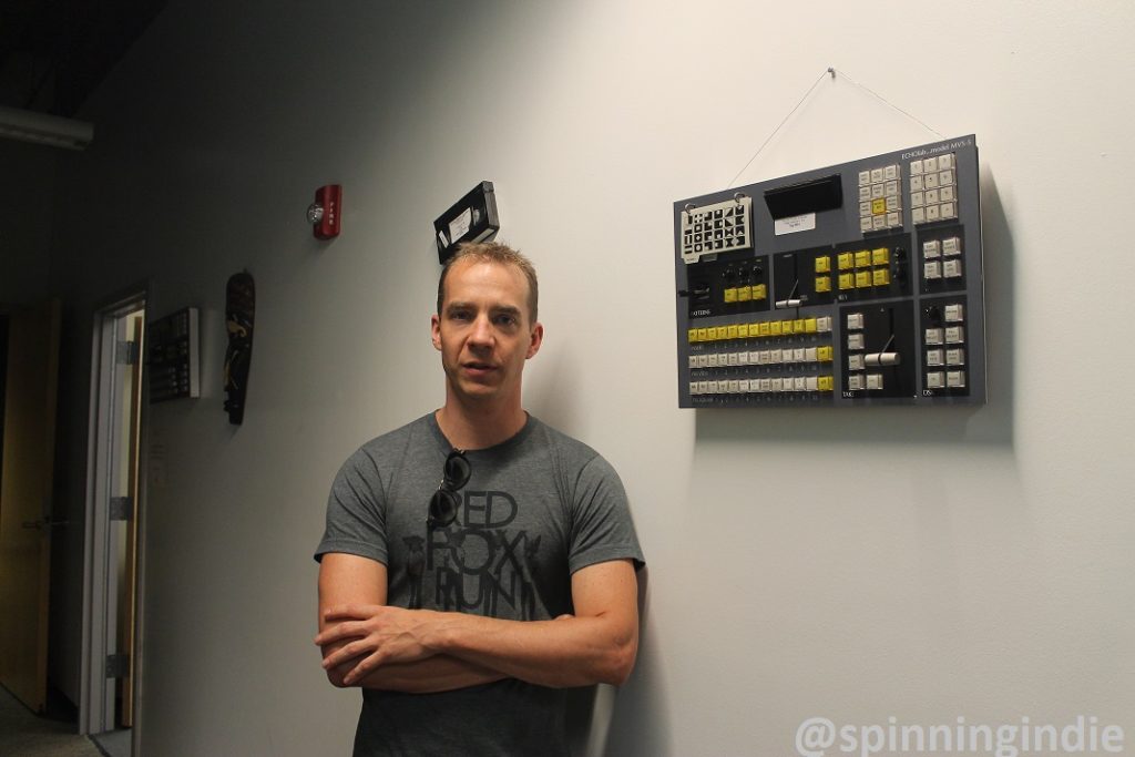 Dave Dieter in hallway at Denver Open Media. Photo: J. Waits