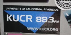 Radio Station Visit #175: KUCR at UC Riverside Photo of wall at college radio station KUCR, with KUCR 88.3 sticker in the center. Photo: J. Waits