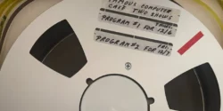 Podcast #342 – The Famous Computer Cafe Photo of open reel tape with The Famous Computer Cafe written on it